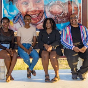L-R: Barbadian artists Versia Harris, Amelia Rouse, Anna Gibson and Dion Gibson. Artwork by Anna Gibson as part of the Fresh Milk / Healing Arts Initiative Public Art Project. Photo by Dondré Trotman.