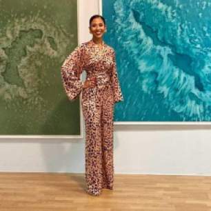 Barbadian artist Taisha Carrington with her work in the exhibition ‘TRANS-SISTORS’ - a collaboration between the BIAC-Réseaux and Fresh Milk co-managed project Caribbean Linked - at the La Véranda Gallery of the Tropiques Atrium, Scène Nationale in Fort de France, Martinique. Photo courtesy of the artist.