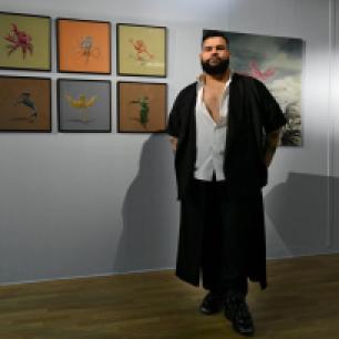 Dominican artist Franz Caba with his work in the exhibition ‘TRANS-SISTORS’ - a collaboration between the BIAC-Réseaux and Fresh Milk co-managed project Caribbean Linked - at the La Véranda Gallery of the Tropiques Atrium, Scène Nationale in Fort de France, Martinique. Photo courtesy of the artist.
